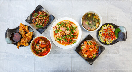 Traditional northeastern Thailand floods, Many variety various Isaan foods on a table.