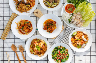 Fototapeta na wymiar variety of Thai food Including menu Miang, crispy pork, steamed shrimp with vermicelli