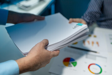 Hand a pile of important documents to a co-worker, Forward a summary of the previous month's...