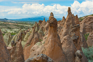 Rock formations in the form of bizarre forms created by nature in the Devrent Valley, Cappadocia