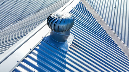 Drone aerial photograph of Whirlybird a grey coated corrugated iron roof on a domestic residence