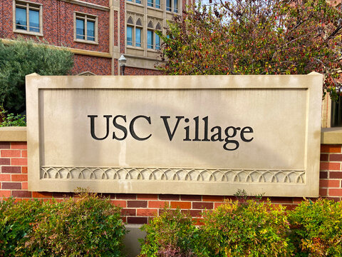 USC Village sign at the entrance to residential and retail center of University of Southern California - Los Angeles, California, USA - December 21, 2023