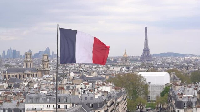 French Flag Floating In the Wind Over Paris Skyline, Main Monument adn Rooftop - Slow Motion