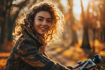 Plexiglas foto achterwand  Young pensive dreamful happy woman 20s wearing casual green jacket jeans riding bicycle bike on sidewalk in city spring park outdoors, look aside People active urban healthy lifestyle cycling concept © Ainur