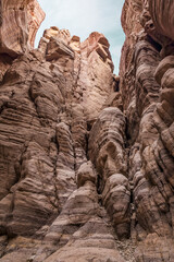 Tall  rocks painted with beautiful natural patterns along the walking trail in the Wadi Numeira gorge in Jordan