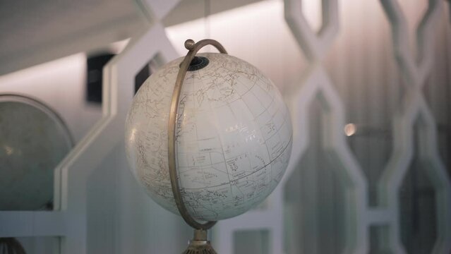 Vintage globe on an elegant interior shelf