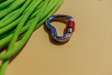 two ropes with secure knots are connected by a carabiner. Equipment for rock climbing and mountaineering. reliable connection. concept of reliability and strength.