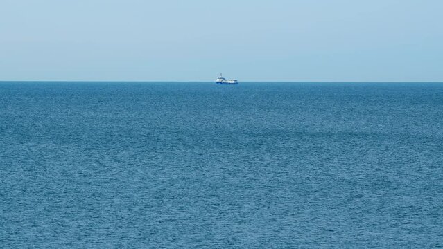 Seafood Production In The Sea Or Ocean. Fishing Boat Sails In The Open Sea. Real time.