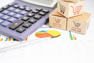 Fototapeta premium Online shopping, Shopping cart box on business graph, import export, finance commerce.