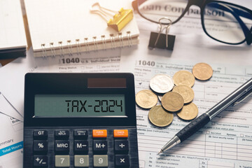Word Tax 2024 on the calculator with the tax form. planning and Accounting Income Statement. paying...