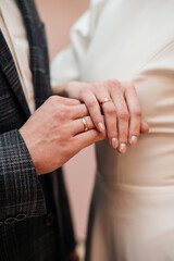 A couple in love holding hands at a wedding ceremony