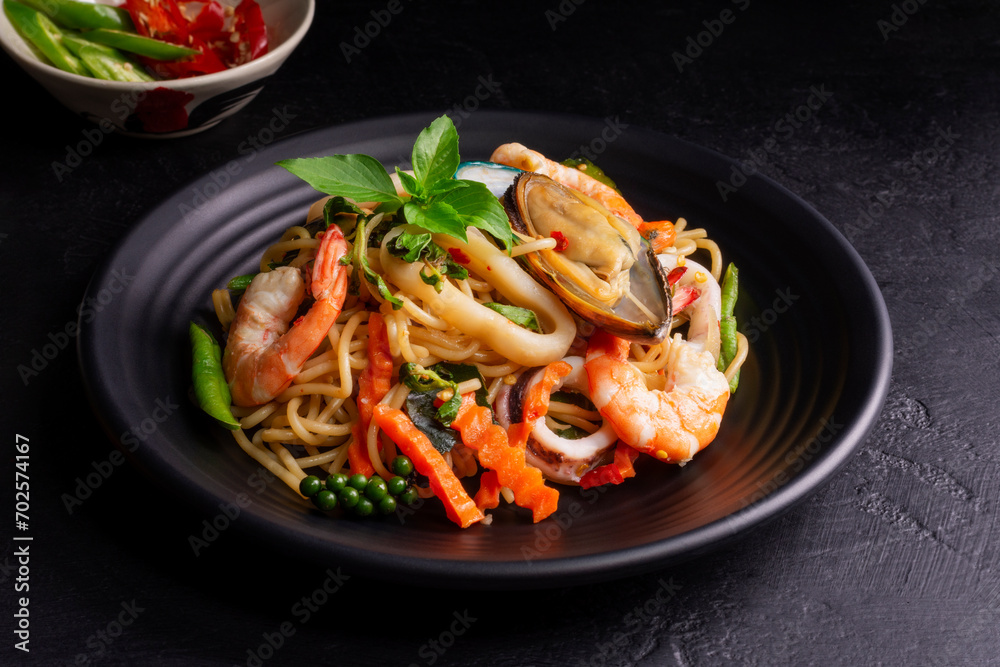 Canvas Prints seafood drunken spaghetti with shrimp squid clams chili, and basil. thai food. healthy asian in a pl