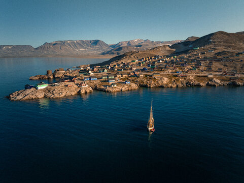 Sunlit Isolation: Aerial View of Ittoqqortoormiit, Greenland's Remote Settlement