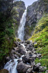 Devils Punchbowl Waterfall is a stunning 131 m waterfall where you can feel the full force and sound of the fresh mountain waterfall from Arthur's Pass National Park New Zealand. 