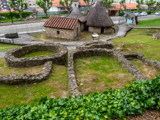 View of the hill fort (castro) of the city of Vigo with two reconstructed cabins. Galicia, Spain.