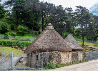 Fototapeta na wymiar Two reconstructed cabins in the hill fort of the city of Vigo. Galicia. Spain.