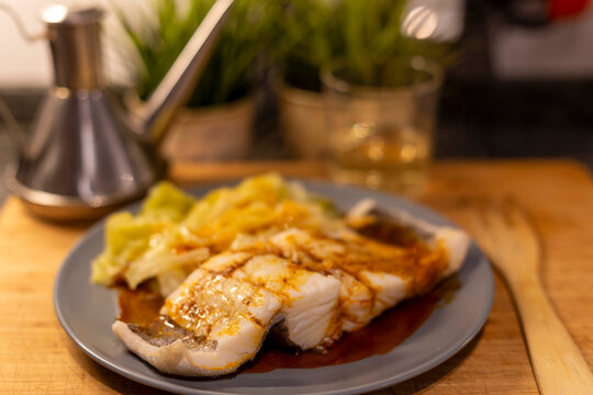 Cod cooked with cabbage and ajada. Selective focus. Galicia.