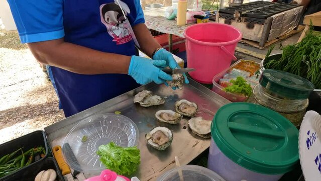 Fresh Oyster Preparation at Market Stall