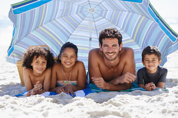 Father, children and family on beach, happy in portrait for summer vacation with parasol, bonding and love. People outdoor for holiday in Brazil with sand and sun, travel and adventure together