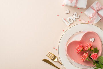 Intimate dinner setup: top view heart-shaped plate, cutlery, roses, sprinkles and a 