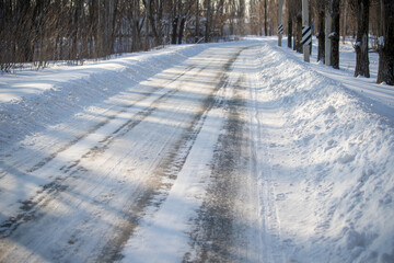 Snowy road, cold winter landscape.