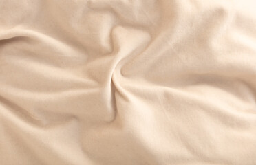 Fototapeta premium Beige fabric as an abstract background. Texture