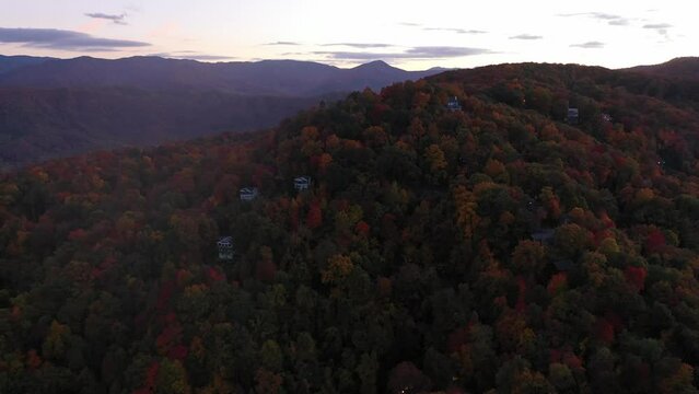 Cinematic Aerial of the Smoky Mountains and cabins in Fall Colors, Pigeon Forge, TN