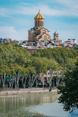 View on the Sameba cathedral and its golden dome from the Narikala fortress in old Tbilisi (Georgia)