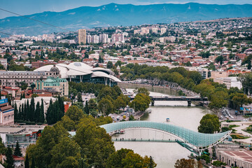 View on the Koura river, the Freedom bridge, the modern hall of justice and the coty center of Tbilisi, the capital city of Georgia