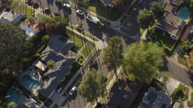 4K cinematic overhead shot of houses, apartments, streets and palm trees in Los Angeles California.