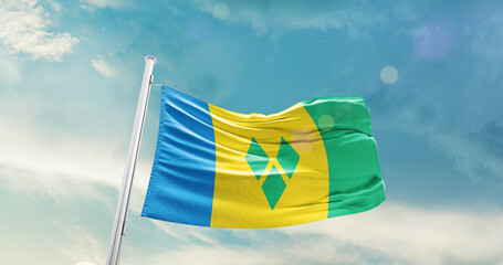 Saint Vincent and the Grenadines national flag cloth fabric waving on the sky - Image