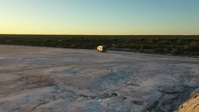 Forward Shot RV Overlanding Expedition Truck Parked Salty Area End of the Day Wild Landscape