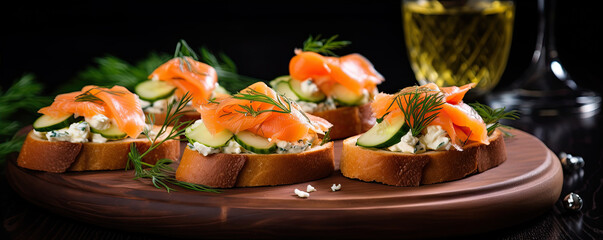 Fresh canapes topped with cheese, smoked salmon on bread.