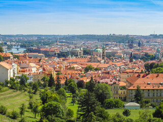 Fototapeta na wymiar Old town of Prague. Czech Republic over river Vltava with Charles Bridge on skyline. Prague panorama landscape view with red roofs.