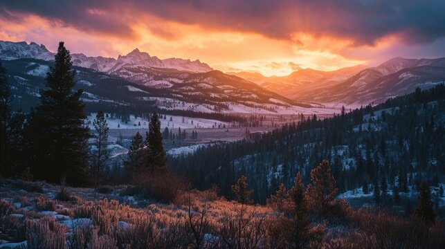 dawn light over the Rocky Mountains with a layer of morning mist, new day awakening, vibrant oranges and purples of dawn, peaceful and refreshing. © Татьяна Креминская
