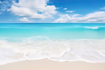Pristine beach with clear turquoise waters under a blue sky