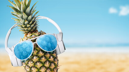 Funny pineapple with headphones at the beach - obrazy, fototapety, plakaty