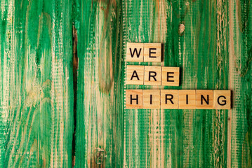 Fototapeta na wymiar Wooden cubes with We Are Hiring letters