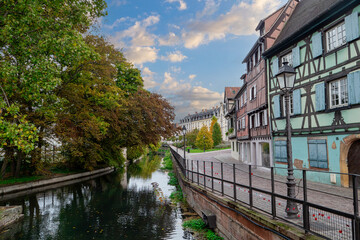 picturesque street of half-timbered frame buildings of town of Colmar, France - obrazy, fototapety, plakaty