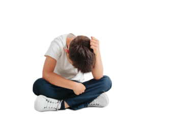 a child whose depression is sitting on the floor
