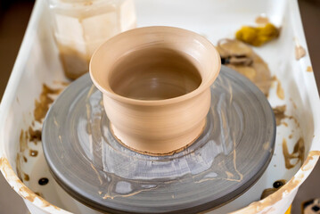 Closeup view of making a clay pot