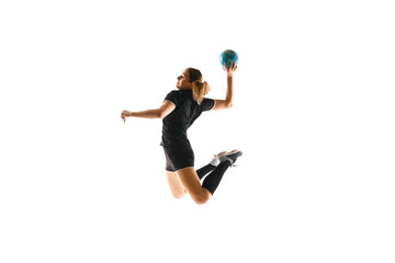 Professional handball player in action against white background, exhibiting strength and agility in...