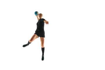 Fit, focused woman engaged in handball drills, displaying determination and focus against white studio background. Concept of sport, hobby, movement, dynamic, active lifestyle, workout, championship.