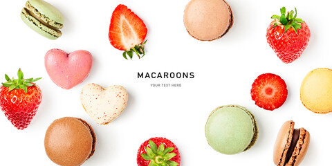 Macaroons, hearts and fresh strawberry berry isolated on white background.