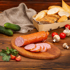 Homemade turkey sausage, on a cutting board, on a dark wooden background