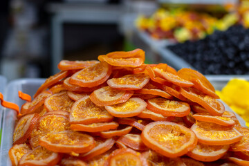 A seller selling delicious Afghan dry fruits snacks items at Industrial trade fair in Kolkata, West Bengal, India.