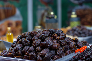 A seller selling delicious Afghan dry fruits snacks items at Industrial trade fair in Kolkata, West Bengal, India.