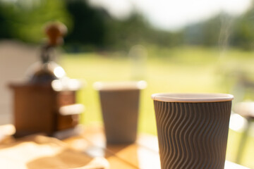 Food lover at Camping! Dripping coffee during camping at natural lake and mountain view background. Recreation and journey outdoor activity lifestyle.