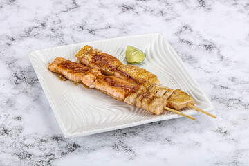 Grilled salmon skewer with sauce