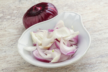 Sliced red onion in the bowl